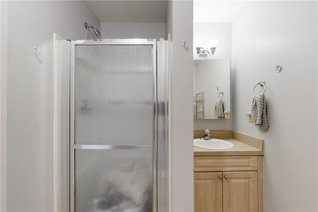 bathroom with vanity and walk in shower