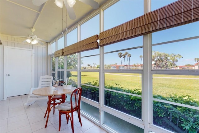 sunroom featuring ceiling fan