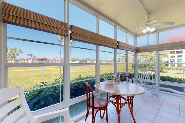 sunroom / solarium featuring ceiling fan