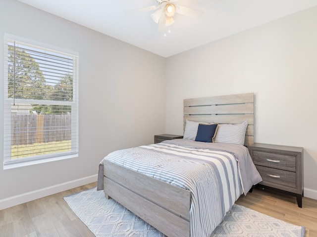 bedroom featuring ceiling fan and light hardwood / wood-style floors