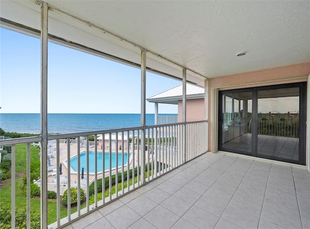 8830 S Sea Oaks Way Unit 301, Vero Beach, FL 32963 - unfurnished sunroom featuring a water view