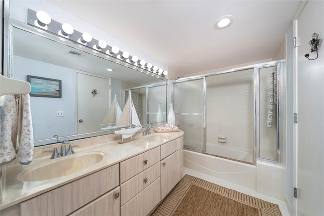 8830 S Sea Oaks Way Unit 301, Vero Beach, FL 32963 - bathroom with double vanity, combined bath / shower with glass door, and tile patterned flooring