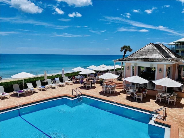 8830 S Sea Oaks Way Unit 301, Vero Beach, FL 32963 - community pool featuring outdoor dining area and a patio