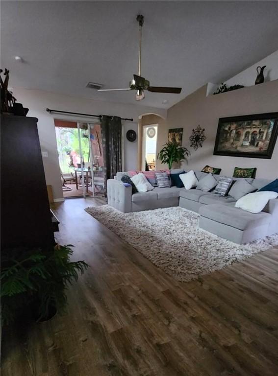 sitting room with ceiling fan and carpet