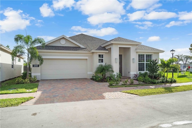 view of front of property with a garage