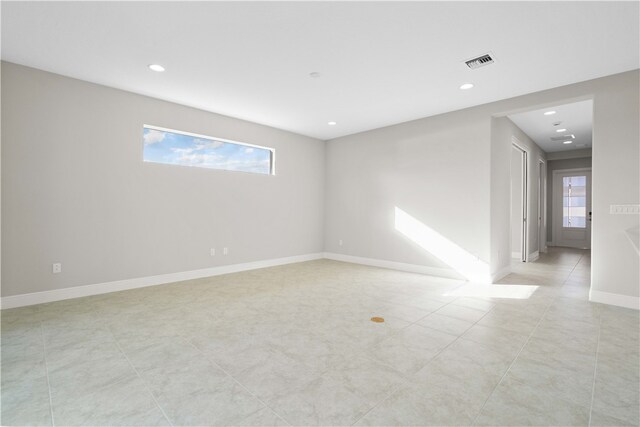 unfurnished room featuring a wealth of natural light