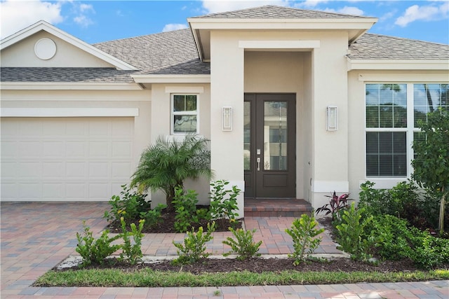 doorway to property featuring a garage