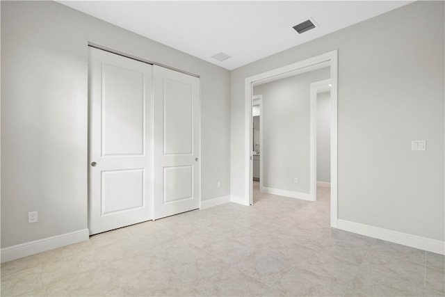 unfurnished bedroom with a closet