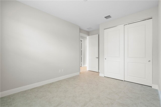 unfurnished bedroom with a closet