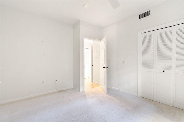 5540 N Harbor Village Dr Unit 103, Vero Beach, FL 32967 - unfurnished bedroom featuring light carpet, visible vents, a closet, and baseboards