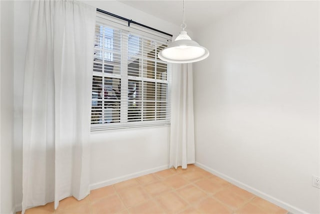 5540 N Harbor Village Dr Unit 103, Vero Beach, FL 32967 - unfurnished dining area featuring baseboards