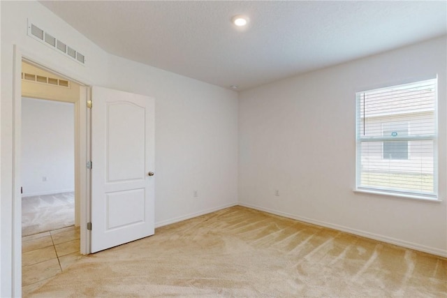 9036 103rd Ave, Vero Beach, FL 32967 - empty room featuring light colored carpet and baseboards
