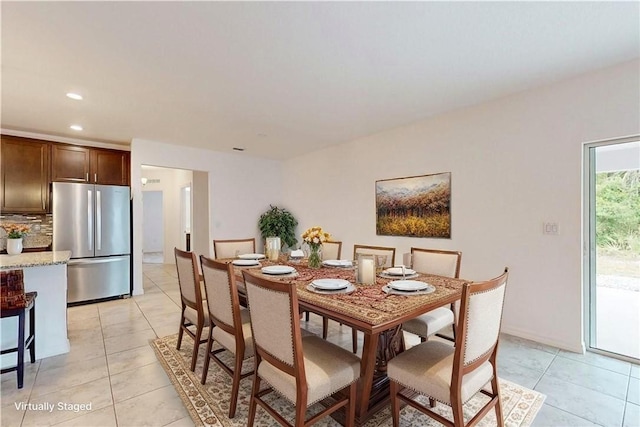 9036 103rd Ave, Vero Beach, FL 32967 - dining room featuring light tile patterned flooring and recessed lighting