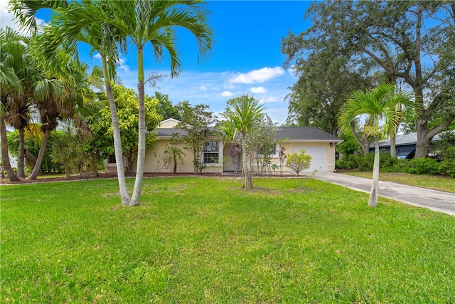 ranch-style home with a front yard and a garage