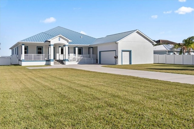 view of front of house with a porch, a garage, and a front lawn