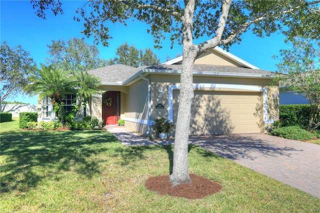 single story home with a front lawn and a garage