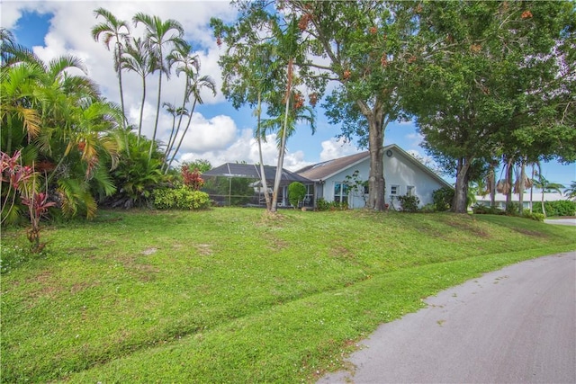 742 Whitmore Dr, Port St Lucie, FL 34984 - view of grassy yard featuring a lanai