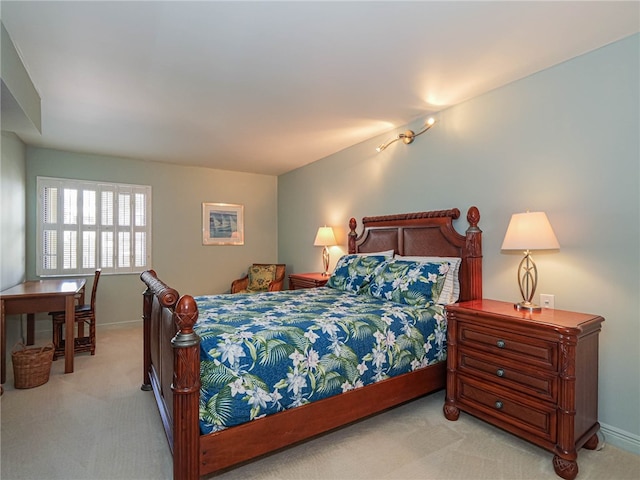 bedroom with light colored carpet