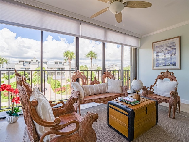 sunroom with ceiling fan