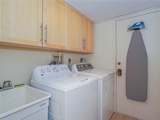 1850 Bay Rd Unit 3G, Vero Beach, FL 32963 - washroom with cabinet space and washer and clothes dryer