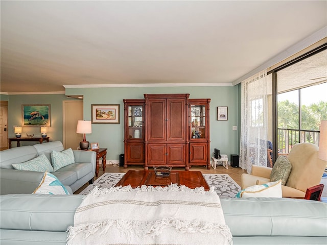 living room with light hardwood / wood-style floors and ornamental molding