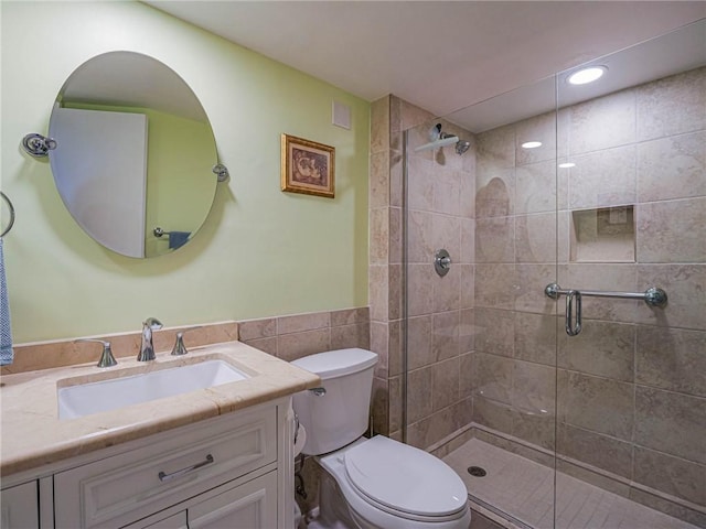 1850 Bay Rd Unit 3G, Vero Beach, FL 32963 - full bathroom with a shower stall, vanity, a wainscoted wall, and recessed lighting