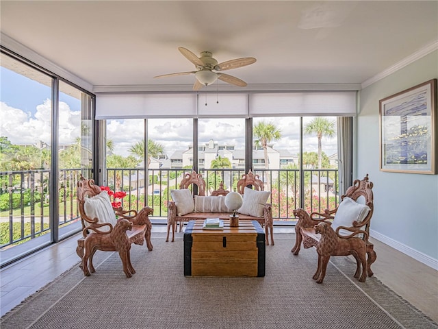 sunroom / solarium with ceiling fan and a healthy amount of sunlight