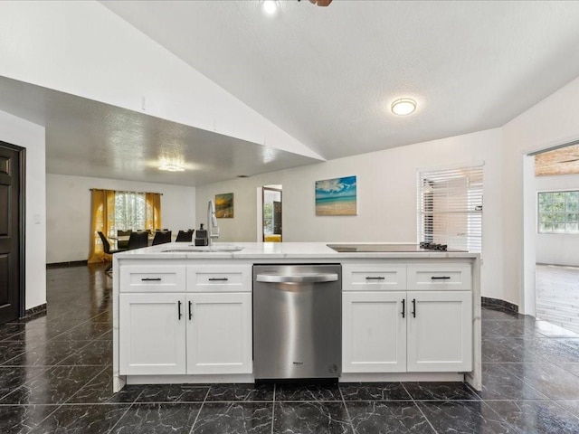 kitchen with stainless steel dishwasher, a sink, dark marble finish flooring, white cabinets, and open floor plan