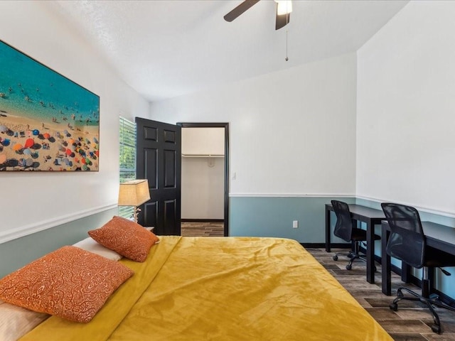 bedroom featuring wood finished floors, ceiling fan, and baseboards