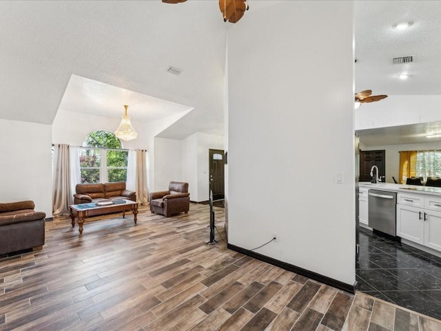 living room featuring a ceiling fan, dark wood-style floors, and high vaulted ceiling
