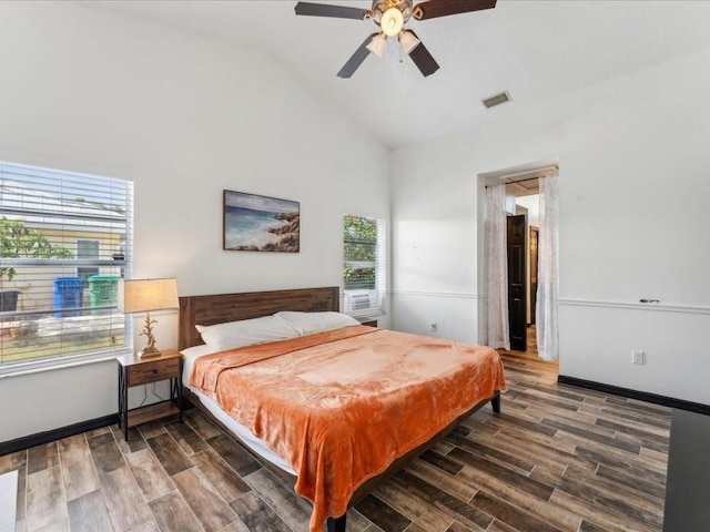 bedroom with wood finished floors, high vaulted ceiling, and ceiling fan