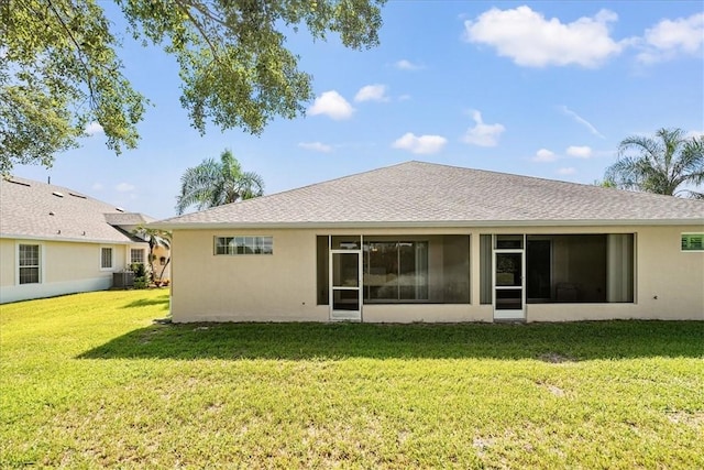 413 W Tangerine Sq SW, Vero Beach, FL 32968 - rear view of property with a yard, stucco siding, and a sunroom
