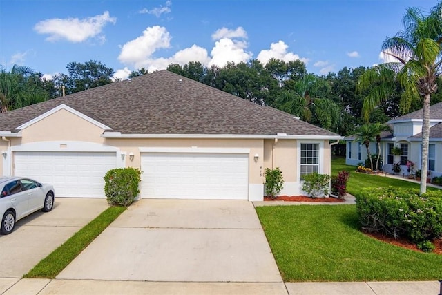 413 W Tangerine Sq SW, Vero Beach, FL 32968 - ranch-style house featuring a front lawn, driveway, stucco siding, a shingled roof, and a garage