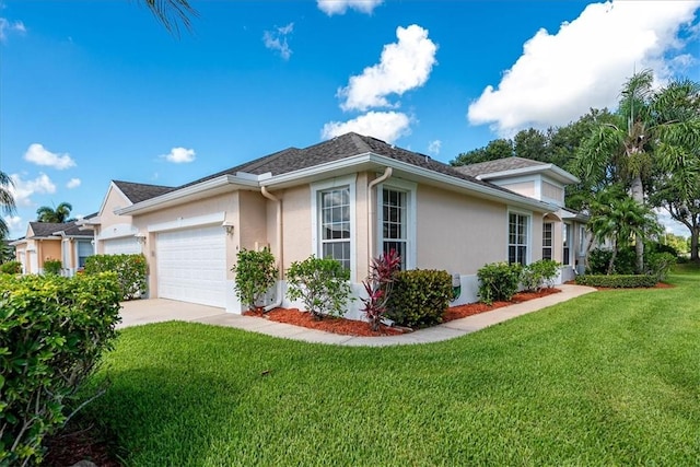 413 W Tangerine Sq SW, Vero Beach, FL 32968 - view of side of property with stucco siding, an attached garage, a lawn, and concrete driveway