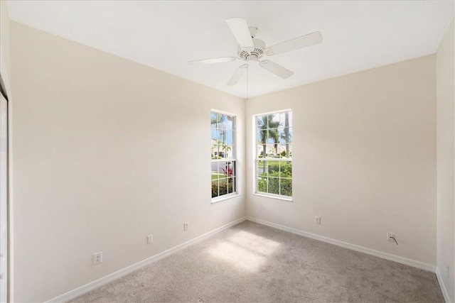 413 W Tangerine Sq SW, Vero Beach, FL 32968 - carpeted empty room featuring baseboards and a ceiling fan