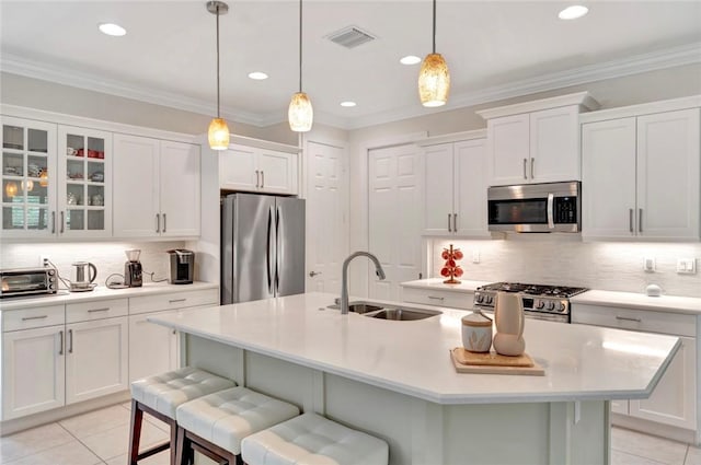 5950 Bella Rosa Ln, Vero Beach, FL 32966 - kitchen featuring stainless steel appliances, light tile patterned floors, light countertops, decorative backsplash, and recessed lighting