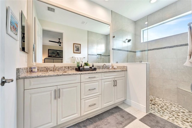 5950 Bella Rosa Ln, Vero Beach, FL 32966 - bathroom with walk in shower, double vanity, and tile patterned flooring