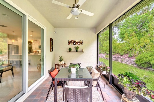 5950 Bella Rosa Ln, Vero Beach, FL 32966 - sunroom / solarium with a ceiling fan and outdoor dining space
