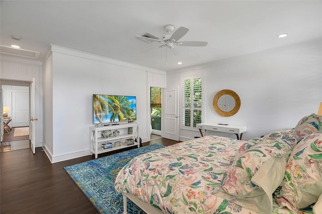 bedroom with crown molding, dark wood-type flooring, and ceiling fan