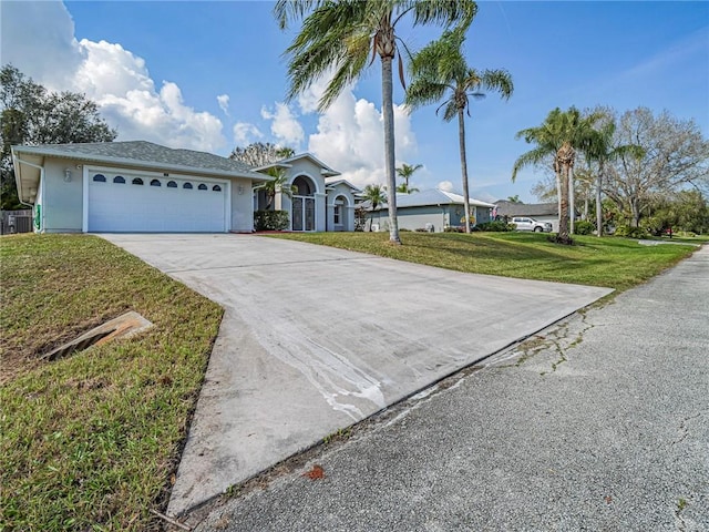 ranch-style home with a garage and a front yard