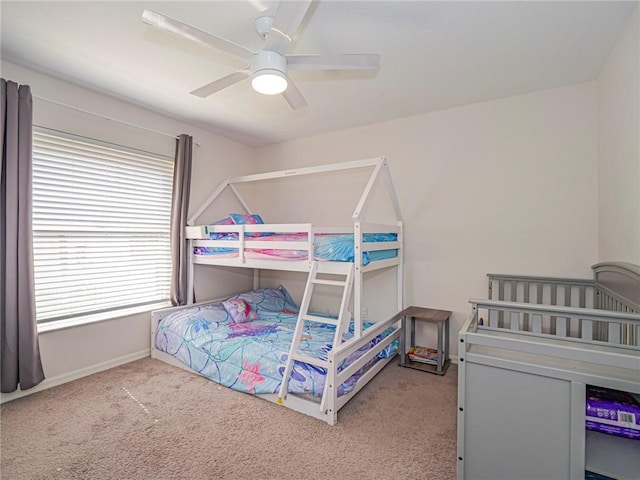 bedroom with light carpet and ceiling fan