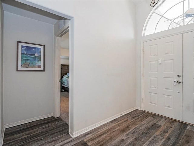 foyer with dark hardwood / wood-style floors