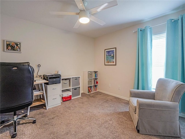 office area with light carpet and ceiling fan