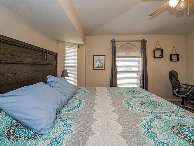 bedroom featuring ceiling fan and vaulted ceiling