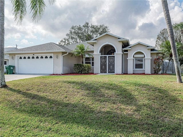 ranch-style house with a garage and a front lawn