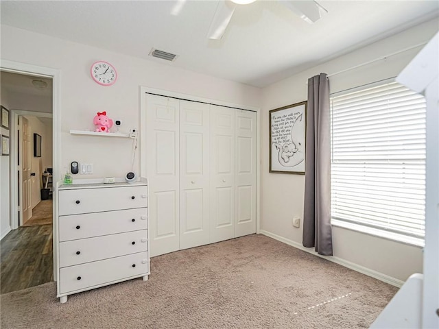 bedroom featuring carpet floors, a closet, and ceiling fan