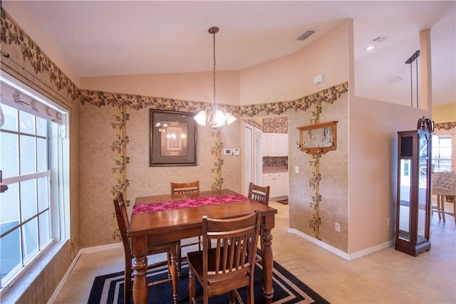 1018 Persian Ln, Sebastian, FL 32958 - dining area featuring lofted ceiling, plenty of natural light, and a chandelier