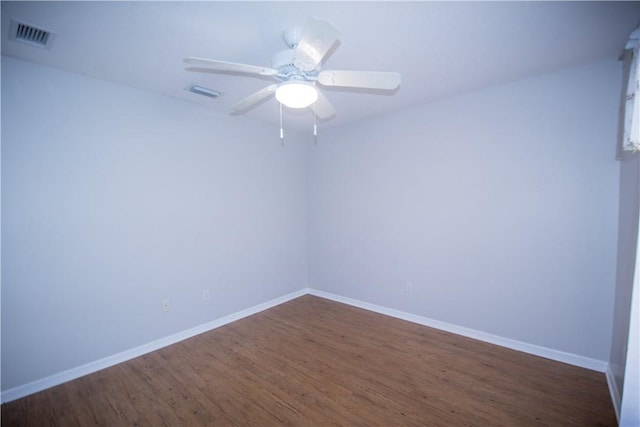 1018 Persian Ln, Sebastian, FL 32958 - empty room featuring dark wood finished floors and ceiling fan