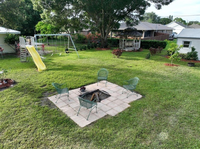 1018 Persian Ln, Sebastian, FL 32958 - view of yard with a playground, a gazebo, a fire pit, and a patio area