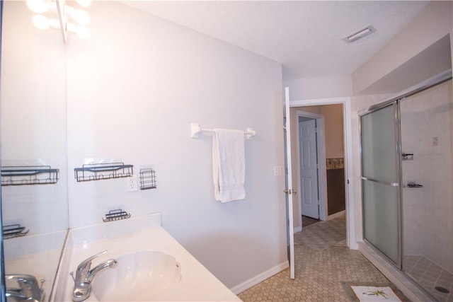 1018 Persian Ln, Sebastian, FL 32958 - bathroom with a shower stall, vanity, and tile patterned floors